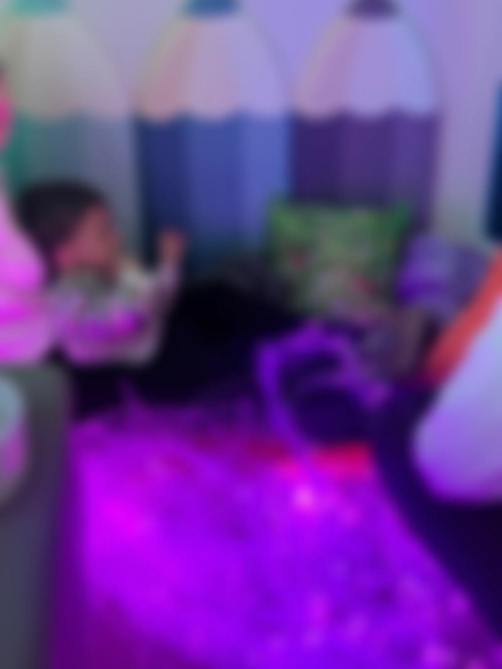 Cosy sensory den with cushions and purple fibre-optic lights